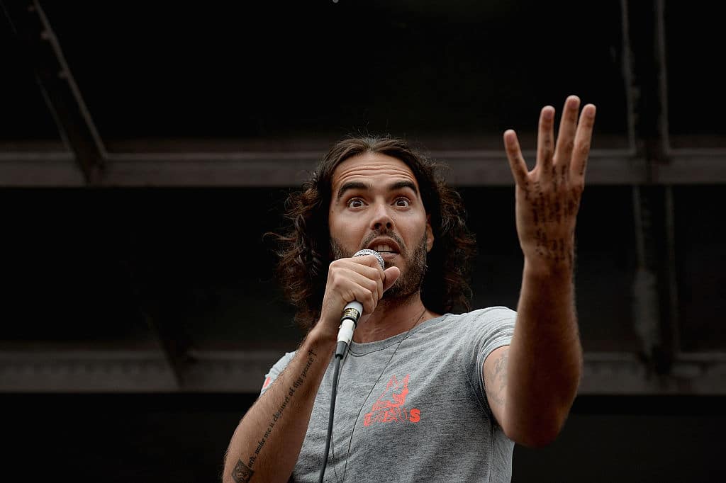 Russell Brand ‘baptised’ while making oblique Catholic references